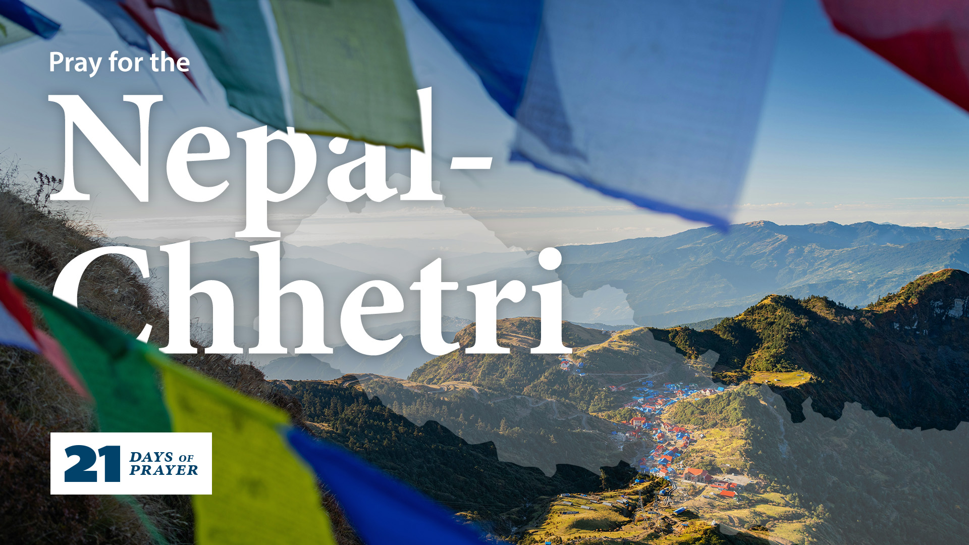 Buddhist prayer flags fly above a mountain village in Nepal.